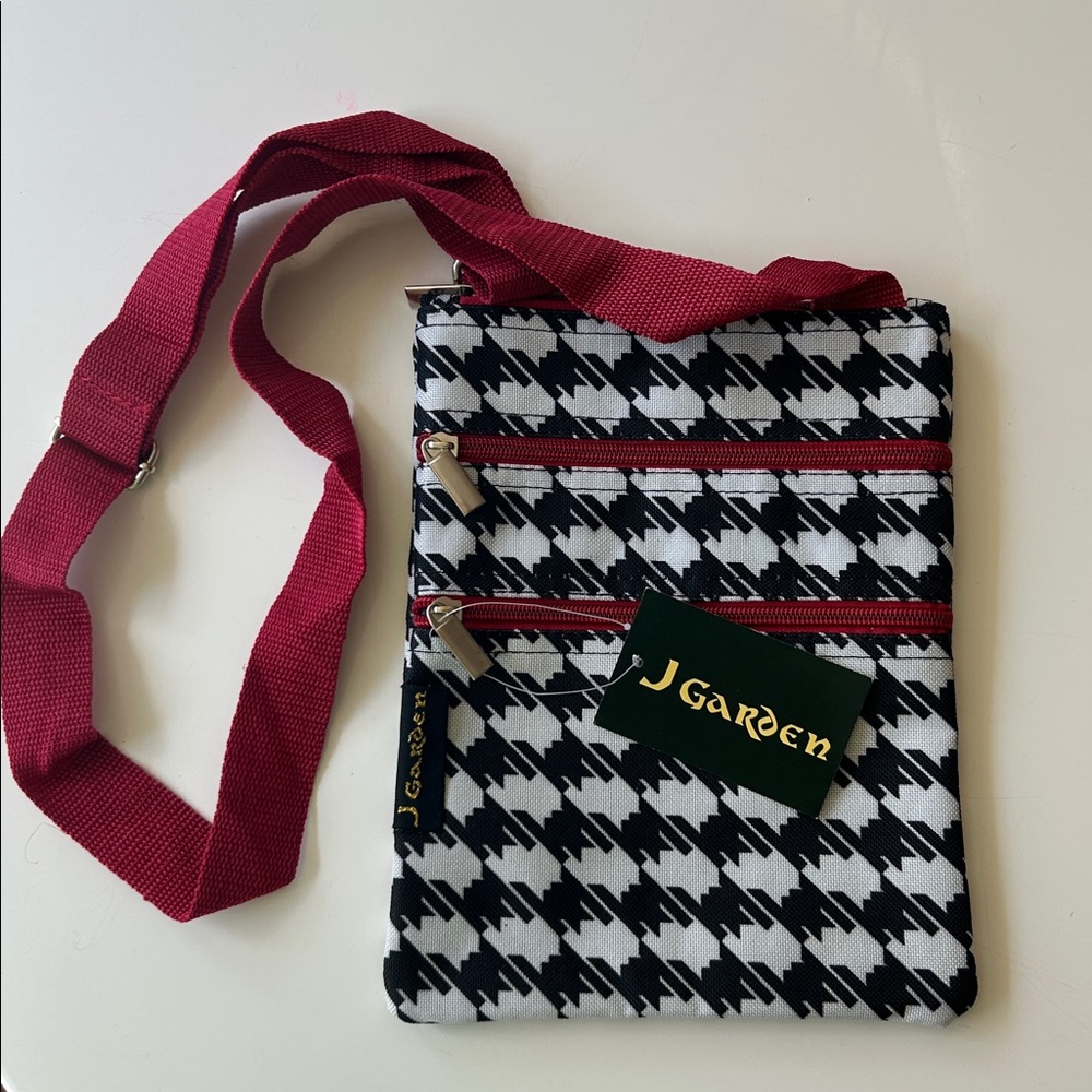 Stylish Black and White Patterned Bag with Red Accents